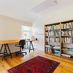 \'Tangerine Gleam\' Cheerful Inner-City Family Abode
