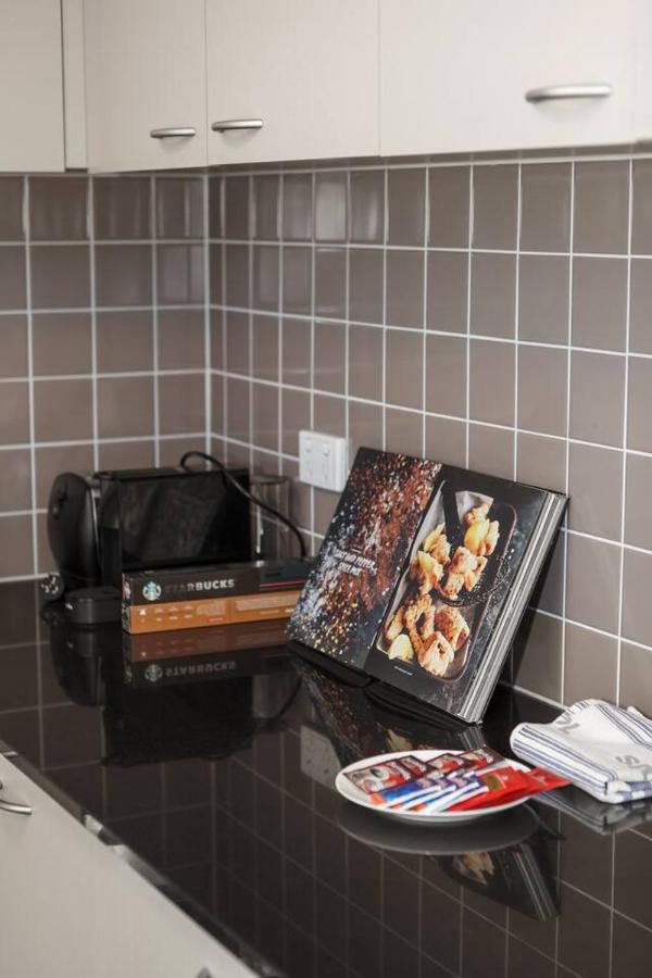 Executive Urban Living With Balcony & Heated Pool Apartment