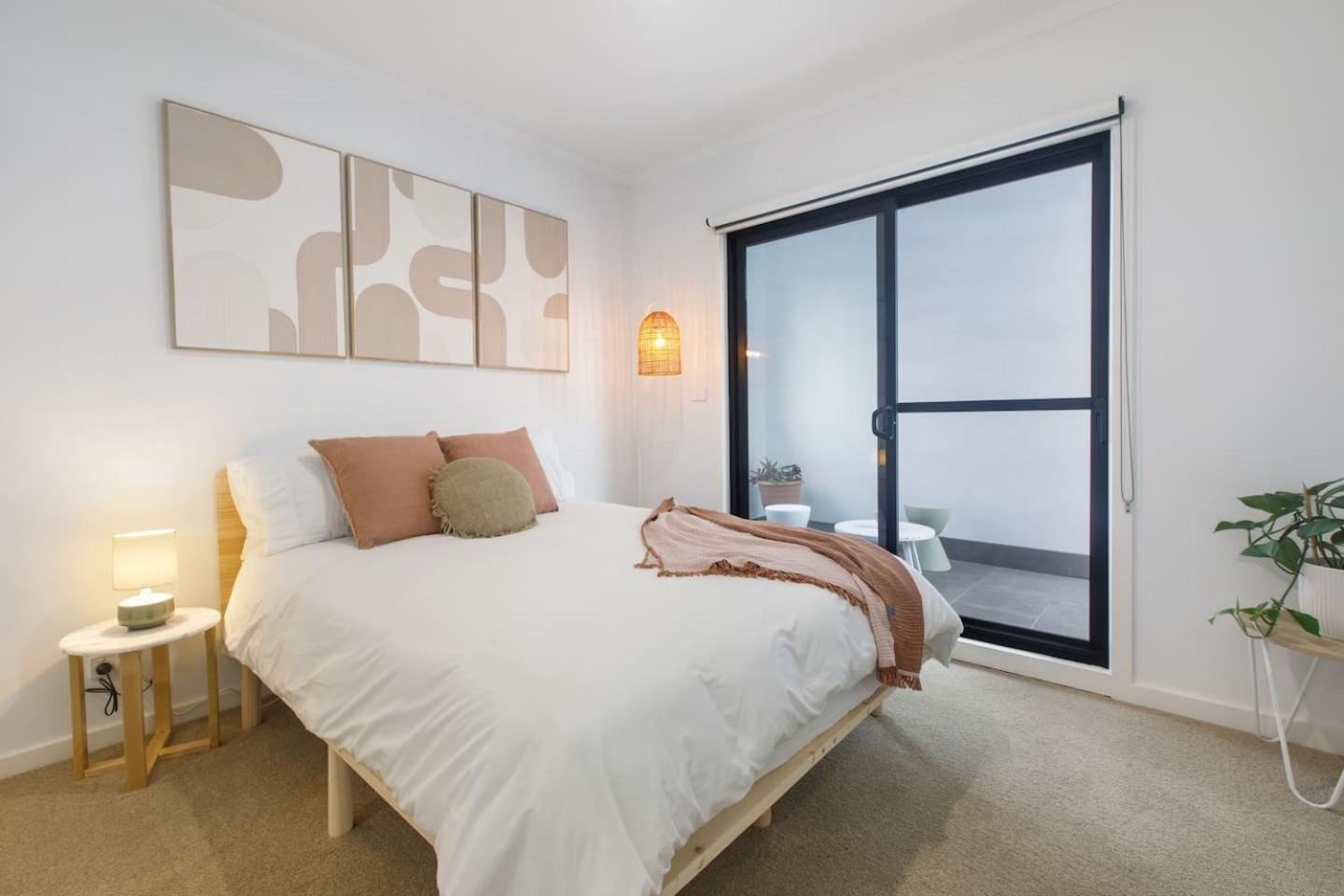 'laidback Lygon' A Two-storey Inner-city Oasis Apartment