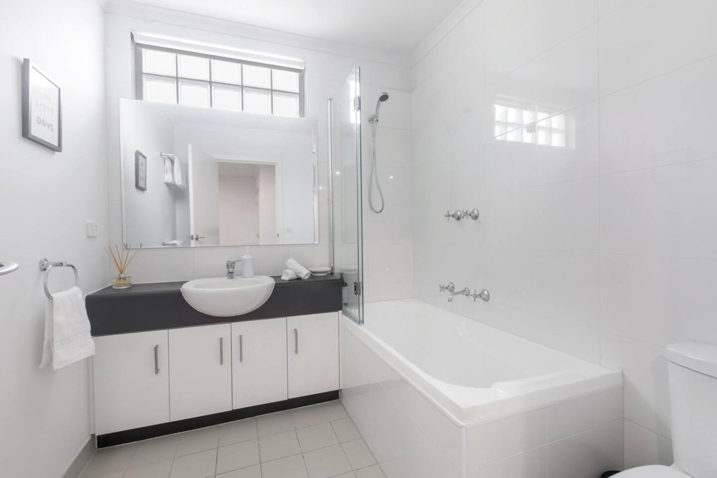 'laidback Lygon' A Two-storey Inner-city Oasis Apartment *